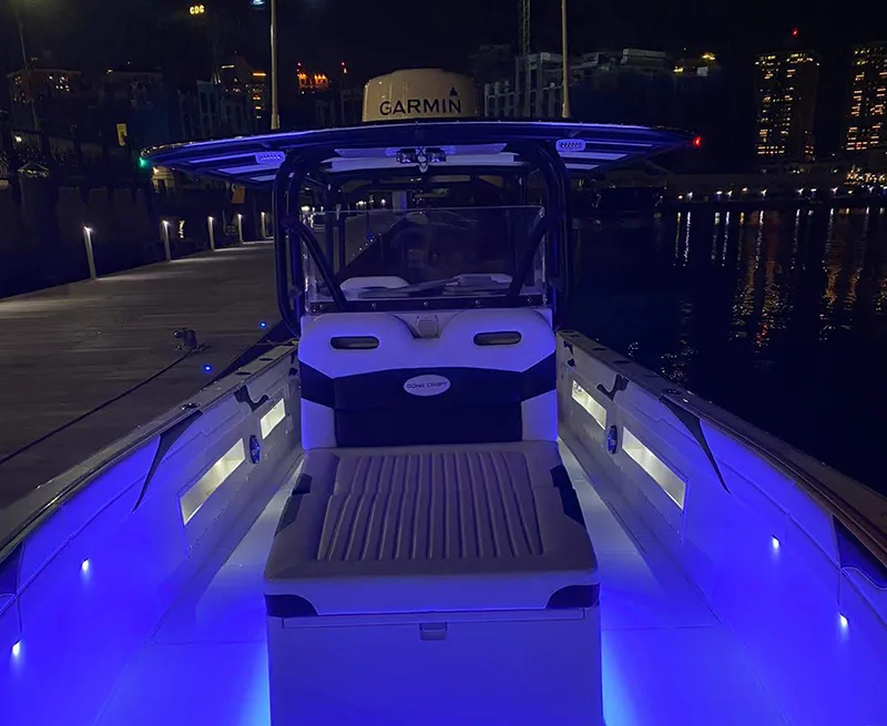 Doha Craft Shark 360 at night with red and blue deck lighting