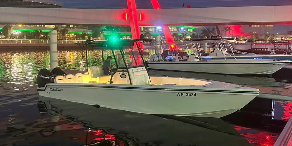 Two Doha Craft boats on trailers at a marine exhibition